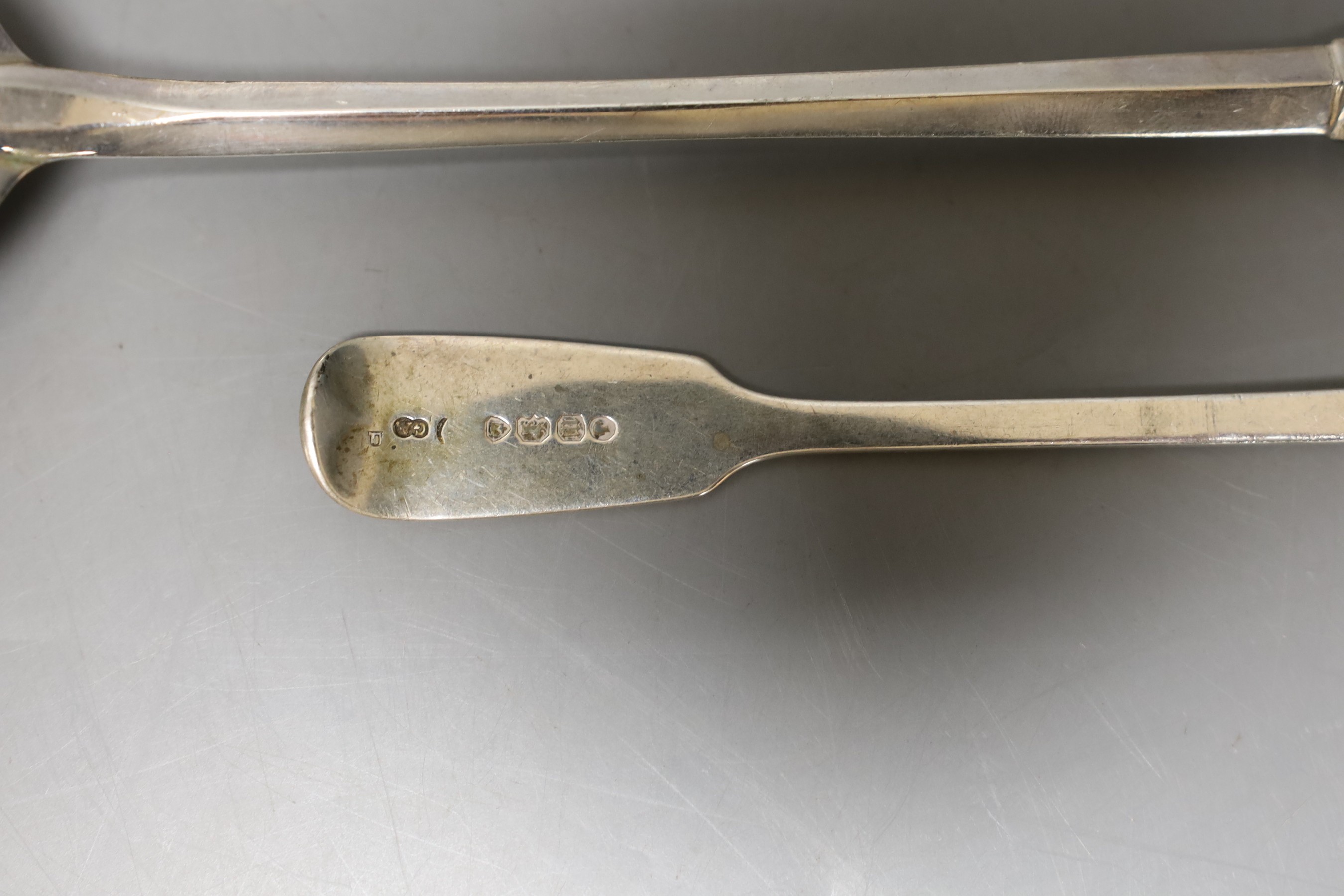 A pair of George V silver serving? spoons, Mappin & Webb, Birmingham, 1930, 19.1cm and an earlier silver condiment spoon, 152 grams.